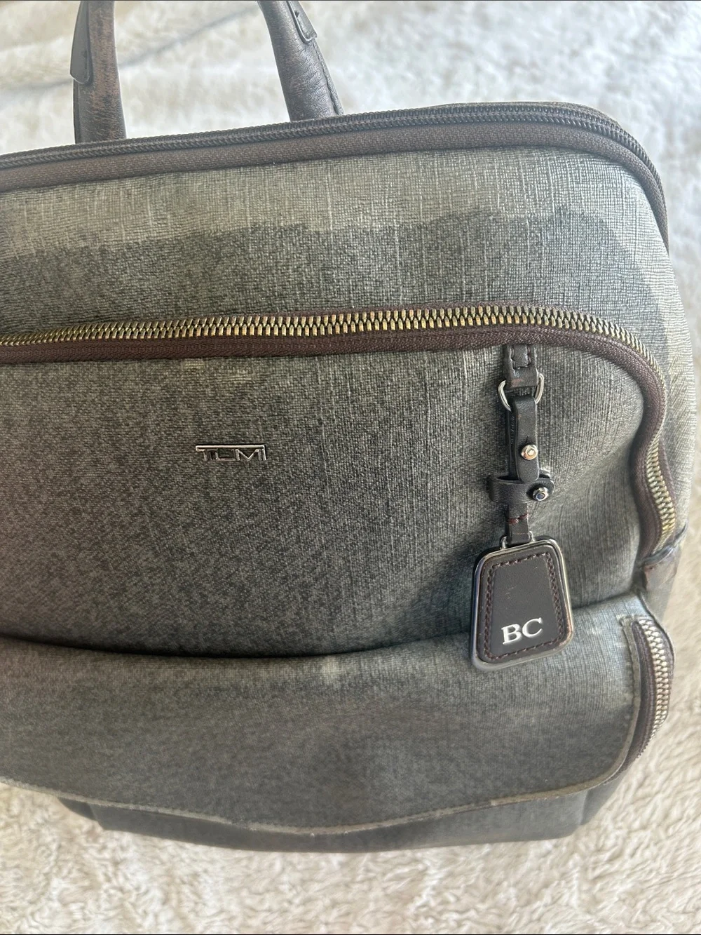 Tumi Gray Backpack with Leather Trim and Monogram Tag